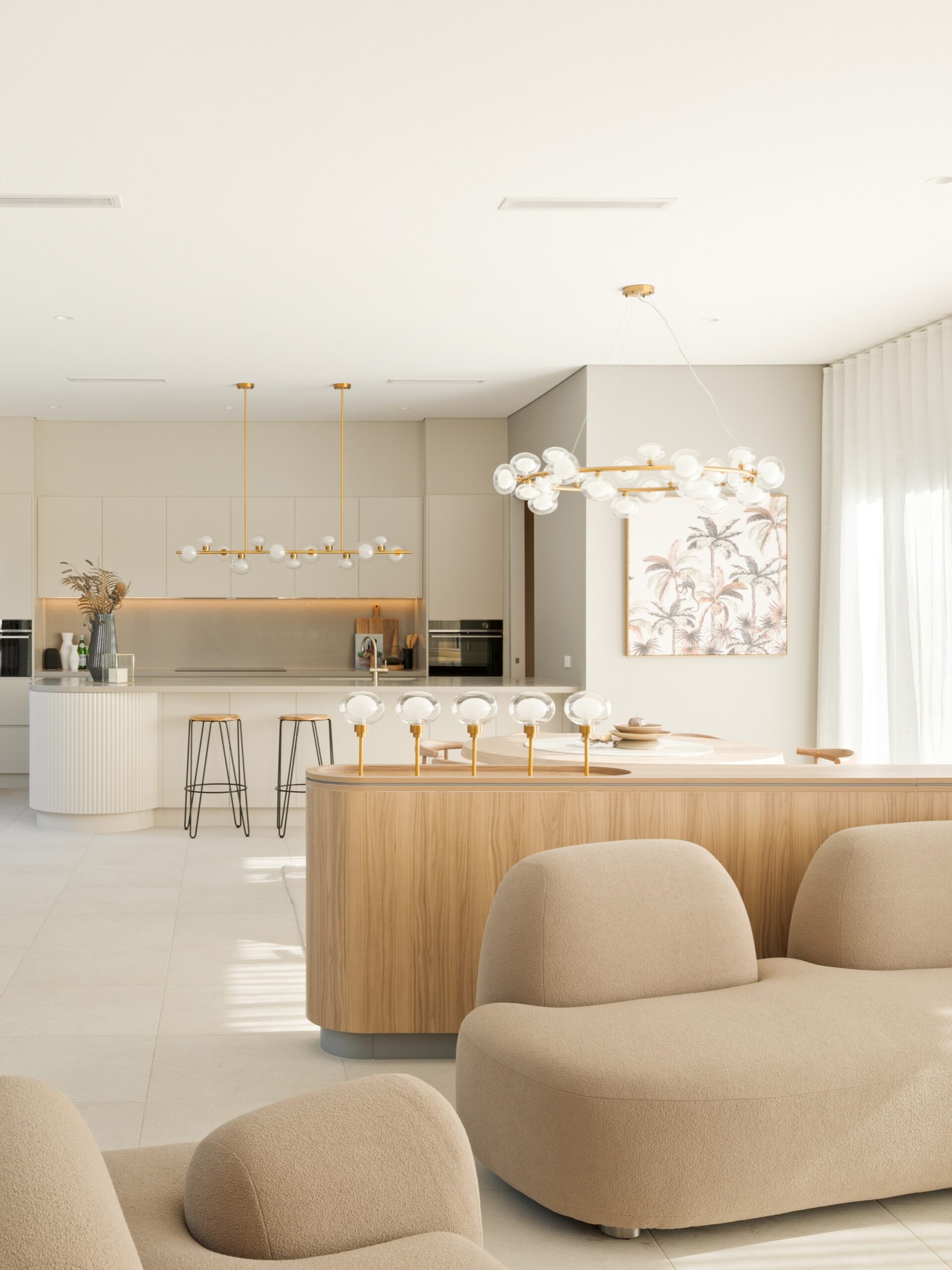Light-filled kitchen and living space featuring soft neutral tones, curved cabinetry, and multifunctional zones—an example of an Australian home design trend focused on flexible, connected living.